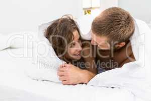 Couple having fun on bed