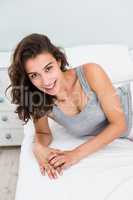 Portrait of beautiful woman smiling on bed