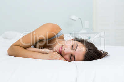 Beautiful woman sleeping on bed