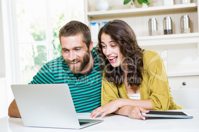 Couple having video chat on laptop