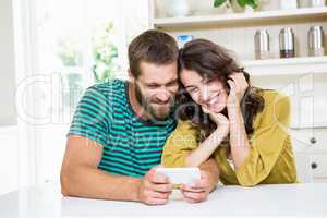 Couple using mobile phone