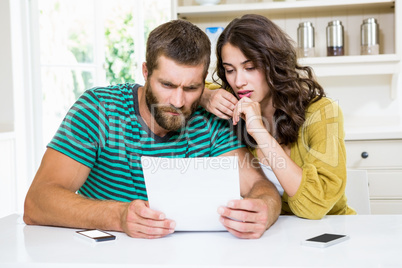 Couple checking their bills