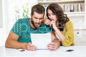 Couple checking their bills