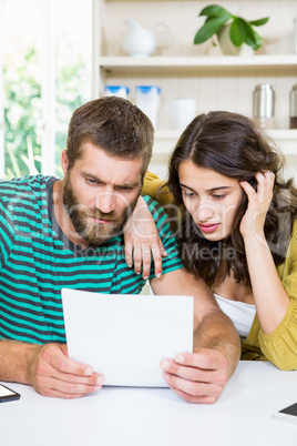 Couple checking their bills