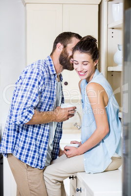 Young couple having fun in kitchen