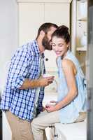 Young couple having fun in kitchen