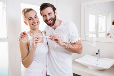 Happy couple checking pregnancy test