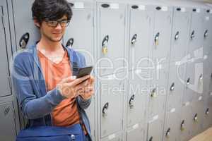 Student using mobile phone in locker room