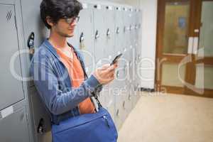Student using mobile phone in locker room