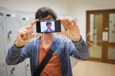 Student taking his selfie on smartphone