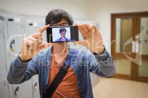 Student taking his selfie on smartphone