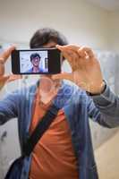Student taking his selfie on smartphone