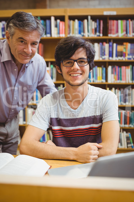 Portrait of smiling student with professor