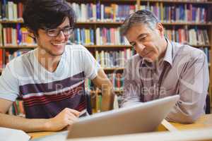 Professor assisting a student with studies