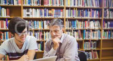 Professor assisting a student with studies