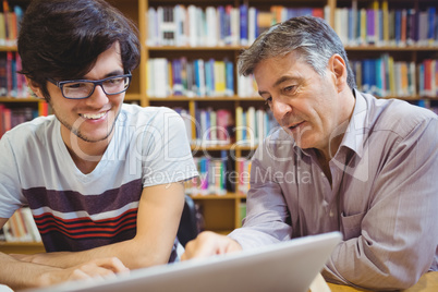Professor assisting a student with studies