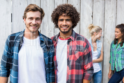 Young men smiling at camera