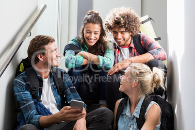 Man showing mobile phone to his friends