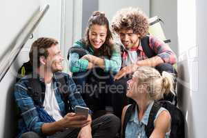 Man showing mobile phone to his friends