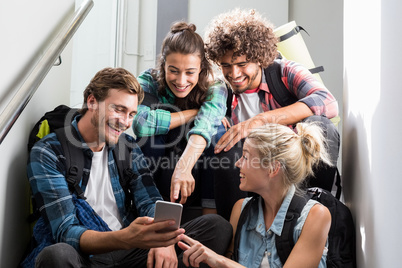 Man showing mobile phone to his friends