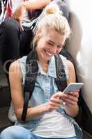 Young woman text messaging on mobile phone
