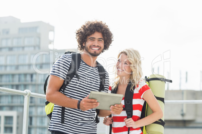 Young couple using digital tablet