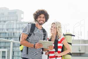 Young couple using digital tablet