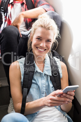 Young woman text messaging on mobile phone