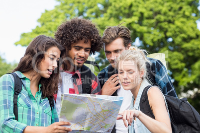 Friends looking at map