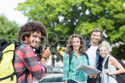 Man taking photo of his friends