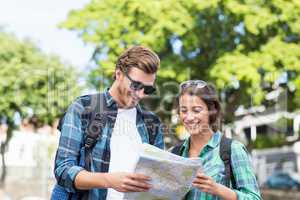 Young couple looking at map