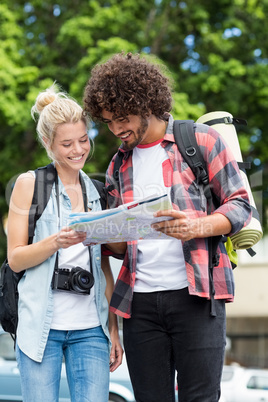 Young couple looking at map