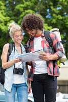 Young couple looking at map