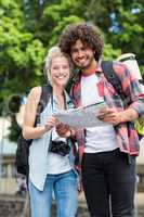 Young couple looking at map