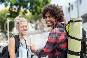 Young couple smiling at camera