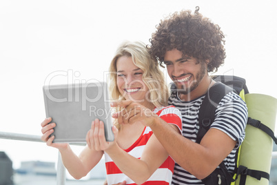 Young couple using digital tablet