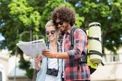 Young couple looking at map