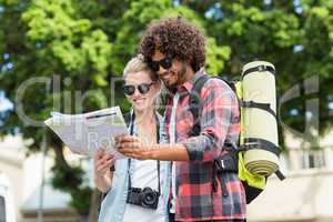 Young couple looking at map