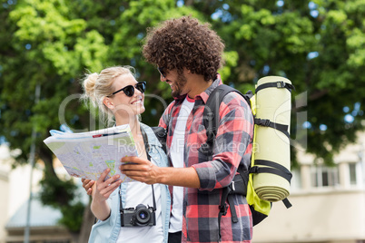 Young couple looking at map