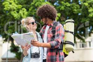 Young couple looking at map