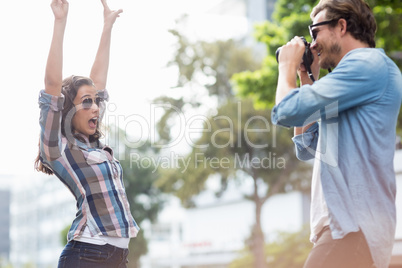 Man taking a photo of his woman