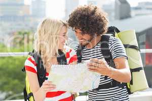 Young couple looking at map