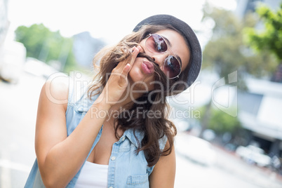Young woman pulling funny faces