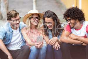 Friends using mobile phone