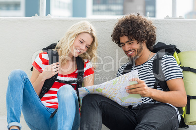 Young couple looking at map