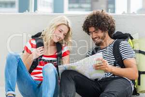 Young couple looking at map