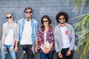 Friends leaning against wall