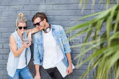 Young couple using mobile phone