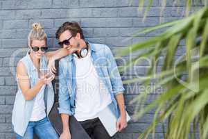 Young couple using mobile phone