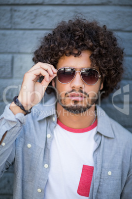 Portrait of young man in sunglasses